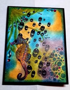 a card with water drops and a seahorse on it