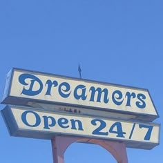 a sign for a restaurant that says dreamers open 24 / 7