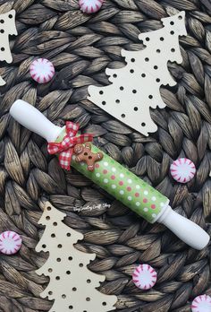 a green and white toothbrush sitting on top of a basket next to christmas decorations