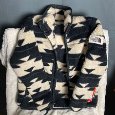 Brand New Kids North Face Fleece Coat With Zipper. Size Medium (10/12). Comfortable Black Outerwear With Fleece Lining, Black Outerwear With Fleece Lining And Cozy Fit, Cozy Black Fleece Jacket For Outdoor, Cozy Black Fleece Jacket For Cold Weather, Cozy Black Fleece Jacket, Argyle Vest, Black Dress Jacket, Navy Denim Jacket, Winter Puffer Coat