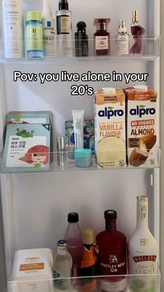 a refrigerator filled with lots of different types of food and condiments on it