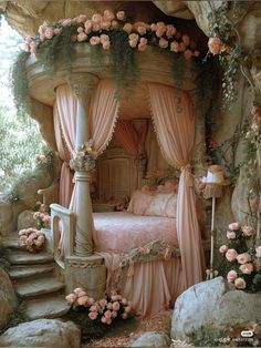 a bed with pink curtains and flowers on the headboard is next to a stone wall