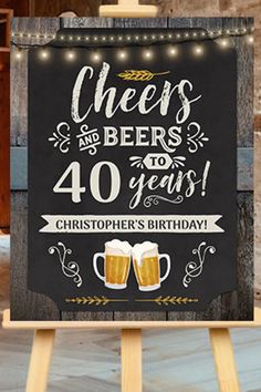 a sign that says cheers and beers for 40 years with two mugs of beer