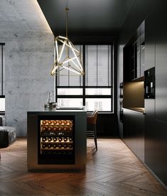 an open wine cooler in the middle of a room with dark walls and wooden floors