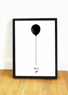 a black and white poster with an image of a balloon hanging from it's side