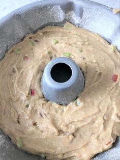 a doughnut pan filled with batter and sprinkles