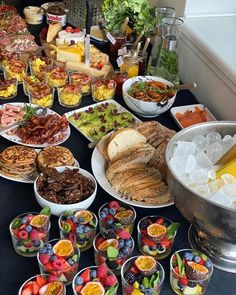 a buffet table filled with lots of food