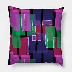 a purple and green pillow with squares on it's side, in front of a white background