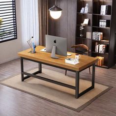 a computer desk with a laptop on it in front of a bookcase and bookshelf