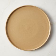 a brown plate sitting on top of a white counter