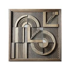 an art piece made out of wood with geometric shapes