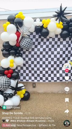 balloons are arranged in the shape of mickey mouses and other characters on a black and white checkered background