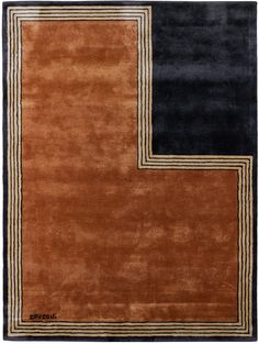 an orange and black rug with gold border