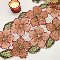 a candle and some flowers on a table