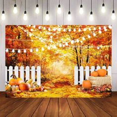 an autumn scene with pumpkins and lights