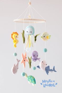 a mobile with sea animals hanging from it's sides