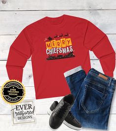 Show your Love for the Kansas City Chiefs with this graphic crewneck long sleeve celebrating Merry Chiefsmas over Arrowhead!  Perfect for the 2023 Christmas Day Game 👕 Sizes & Fit * Gildan Lightweight Long Sleeve -  relaxed fit  * Sizing is unisex so runs like men's, though not overly large * For a fitted look you may want to size down * Soft and comfy it will become one of your most treasured T's. 📦 Shipping 💨 2-7 Business Days Production All of the items are made to order just for you 🌼! Once an order is placed it takes us and our production partner 2-7 business days to produce it. Then we ship it with USPS. 💌 2-7 Business Days Shipment (10-15 Days International) Once your order is shipped USPS promises to deliver it within 2-7 business days. Although they do their best to stick to Long Sleeve Graphic T-shirt For Holidays, Long Sleeve Graphic Print T-shirt For Holiday, Holiday Long Sleeve T-shirt With Letter Print, Merry Chiefsmas, Chiefs Christmas, Kc Football, Football Christmas, 2023 Christmas, Holiday Shirt