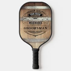 a wooden paddle with an advertisement on the front and back of it that says, premium quality from michigan