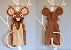 two pictures of a mouse hanging on the wall with clothes pins attached to it's ears