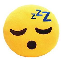 a smiley face pillow with the word zzz on it's forehead and eyes