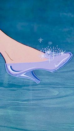 a woman's foot in the water with snow flakes on her shoe and stars above it