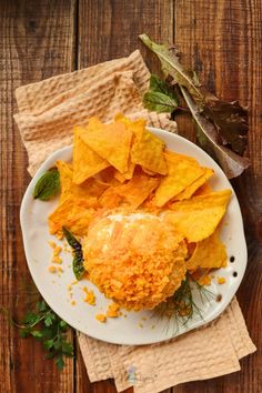 a white plate topped with fried food and chips