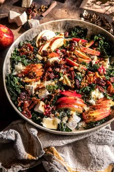 an apple and kale salad in a bowl