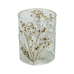 a glass vase with some flowers on the inside of it and gold flakes in the bottom