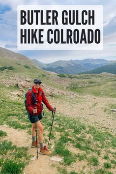 a man with a backpack and hiking poles on a trail