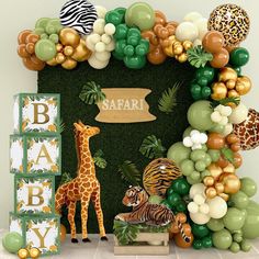 a baby shower with jungle animals and balloons