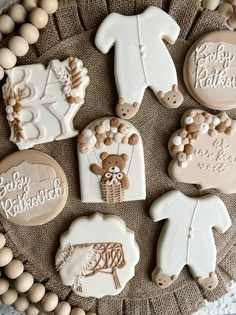 decorated cookies are arranged on a plate