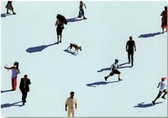 a group of people walking across a snow covered field with a dog running behind them