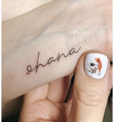 a woman's hand with a small dog on it and the word shana written in cursive writing