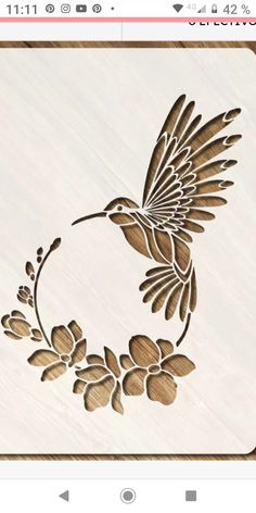 an image of a bird with flowers on it's back and the words, wood carving