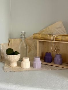 some vases and books on a shelf