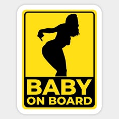 a sign that says baby on board with a silhouette of a woman in black and yellow