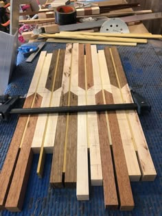 several pieces of wood are laying on top of each other in the process of being made