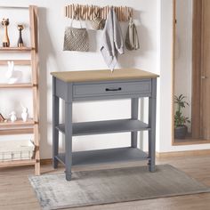 a grey table with two drawers and a shelf