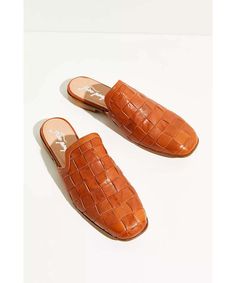 Slip into these timeless Italian leather flats featured in a rounded square-toe design with statement woven detailing for added dimension. Slip-on style Cushioned insole Slight heel Care/Import Made in Italy Contents Leather Heel Care, Toes Designs, Mule Flat, Toe Designs, Leather Flats, Italian Leather, Mule Shoe, In Italy, Slippers