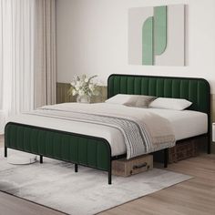 a bed with green headboard and foot board in a white walled room next to a painting on the wall