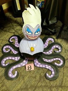 an octopus statue is sitting on the floor