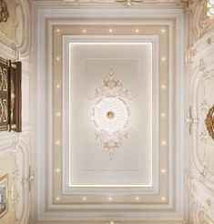 an ornate ceiling in the middle of a room