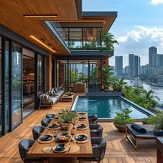 an outdoor dining area overlooking the water and cityscape is featured in this photo