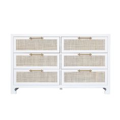 a white dresser with wicker drawers and brass handles on the bottom, against a white background