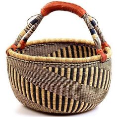 a woven basket with leather handles on a white background