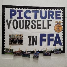 there is a sign that says picture yourself in ffa on it with pictures hanging from clothes pins