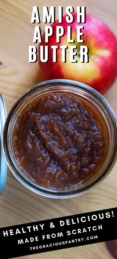 an apple butter in a glass jar on a wooden table with the words, amish apple butter healthy and delicious made from scratch