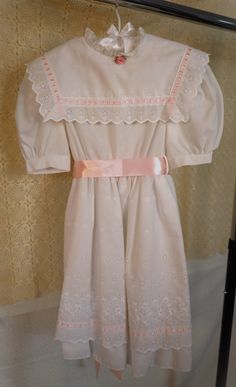 "Vintage 1980s Bonnie Jean White Cotton Lined Squared Ribbon Lace Collared Prairie Dress In Size Juniors 10. Quarter Size Small Stain On The Front Bottom Trim, Not Noticeable.  Have Not Tried Laundering It. See Pictures For Reference. Rose Needs Sewn On, Held By Safety Pin. Overall Good Vintage Condition! Measurements are; Bust: 30\" Waist: 24\" Length: 31\"" Ribbon Collar, Bonnie Jean, Floral Jeans, Cottagecore Dress, Prairie Dress, Front Bottoms, Lace Ribbon, Lace Collar, Safety Pin