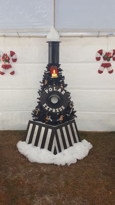 a black and white christmas tree in front of a wall