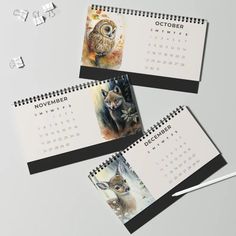 three calendars with pictures of animals on them, one is for november and the other is for october